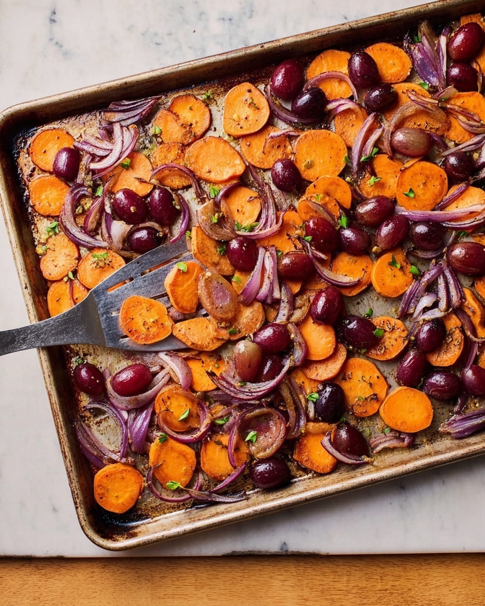 The image shows a baking tray filled with roasted sweet potato slices, red grapes, and thin slices of red onion scattered evenly across the tray. The sweet potato slices are golden-orange with a slightly crispy texture on the edges, while the grapes are plump and deep purple-red. The thin red onion slices add a swirl of dark purple color, and small green herb pieces are sprinkled on top, adding brightness and contrast. A spatula is partially under the ingredients, ready to serve. The tray sits on a white marbled surface. Photo taken with an iphone --ar 4:5 --v 7
